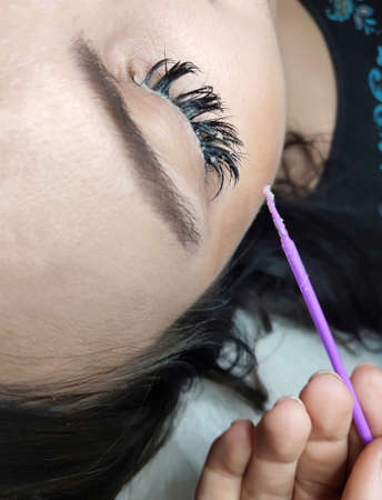 eyelash removal in beauty salon macro eyeの写真素材