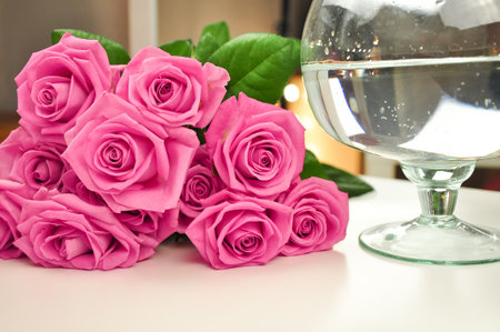 Bouquet of roses on pink background copy spaceの写真素材