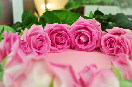 Composition of pink roses in circle on the tableの写真素材