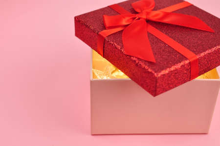Present red box with bow giving gifts for holidays conceptの写真素材