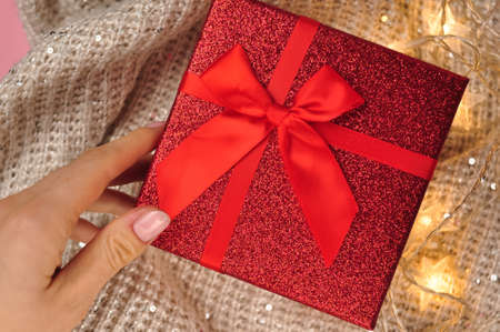Present red box with bow giving gifts for holidays conceptの写真素材