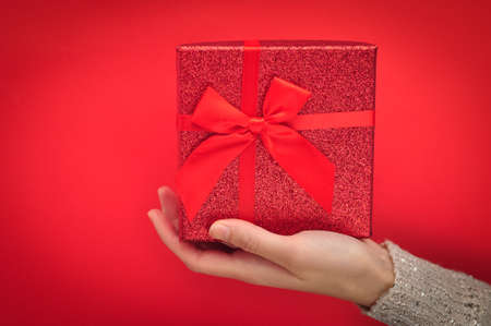 Red present box with bow. Gift for Christmasの写真素材