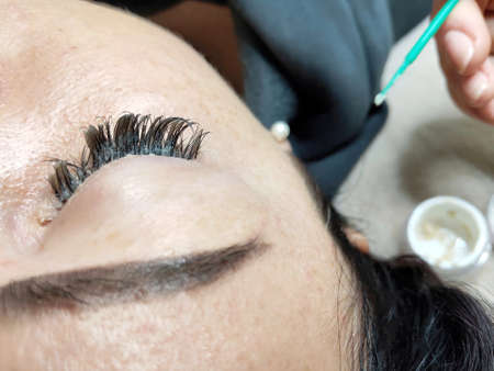 Lash extensions in beauty salon macro eye