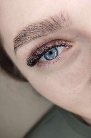 Lash extensions in beauty salon macro eyeの写真素材