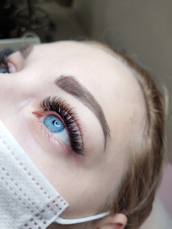 Lash extensions in beauty salon macro eyeの写真素材
