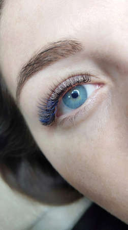 Lash extensions in beauty salon macro eye top viewの写真素材