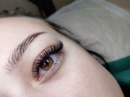 Lash extensions in beauty salon macro eyeの写真素材