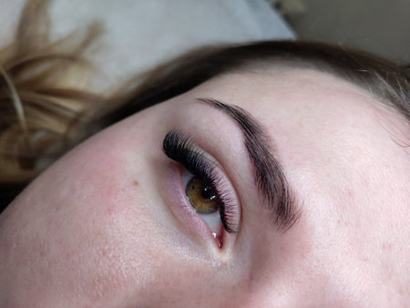 Lash extensions in beauty salon macro eyeの写真素材