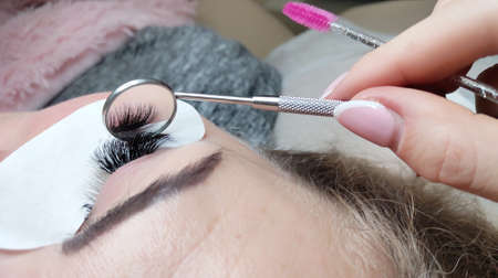 Lash extensions in beauty salon macro eyeの写真素材
