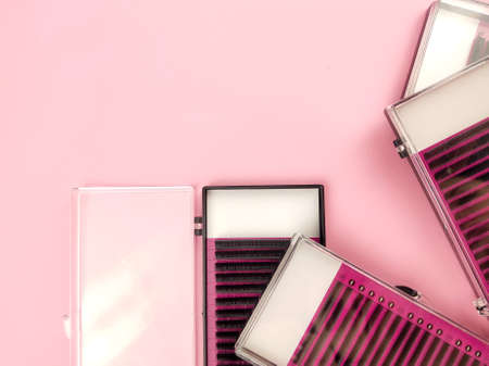 Equipment for eyelash extensions on pink background . High quality photo