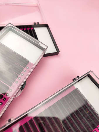 Equipment for eyelash extensions on pink background . High quality photoの写真素材