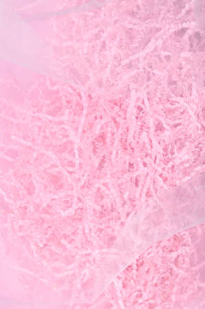 Calm pink background with tissue paper in present boxの写真素材