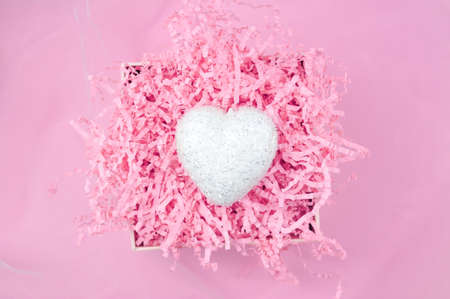 White heart on pink background love concept