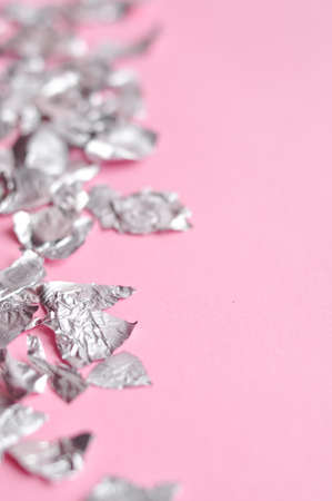 Sheets of steel foil on pink background copy space. High quality photoの写真素材