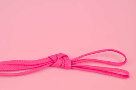 Pink bootlaces on the background copy spaceの写真素材