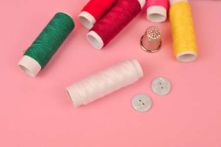 Equipment for sewing on pink background copy space. High quality photoの写真素材