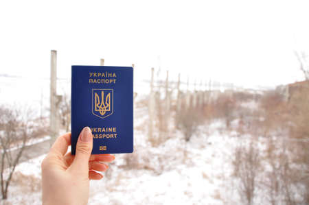 Blue Ukrainian transborder passport of refugee war 2022. Translation from Ukrainian :Ukraine passport. High quality photoの写真素材