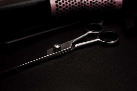 Equipment for hair stylist on black background . High quality photoの写真素材