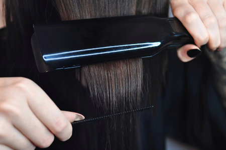 Combing hair with hairbrush macro view copy spaceの写真素材