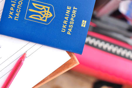 red pen For signing document and Ukrainian international passport . High quality photoの写真素材
