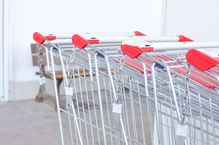 Close up of metal grate of market's trolley with lock copy space. High quality photoの写真素材