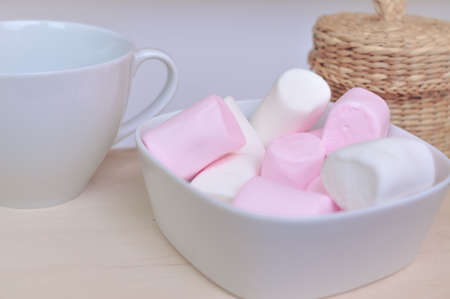 Close up of pink and white fluffy marshmallows sweet candy for tea and coffee breakの写真素材