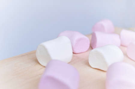 Close up of pink and white fluffy marshmallows sweet candy for tea and coffee breakの写真素材