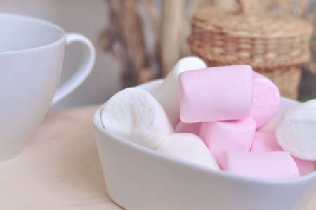 Close up of pink and white fluffy marshmallows sweet candy for tea and coffee breakの写真素材