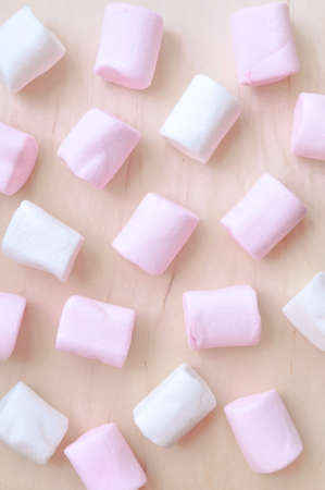 Close up of pink and white fluffy marshmallows sweet candy for tea and coffee breakの写真素材