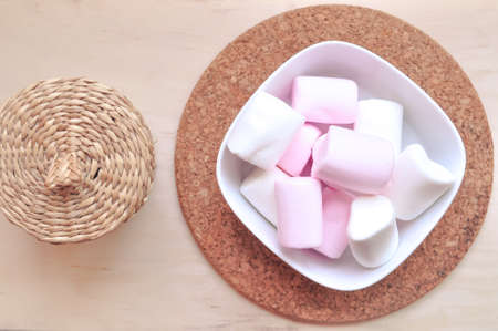 Close up of pink and white fluffy marshmallows sweet candy for tea and coffee breakの写真素材