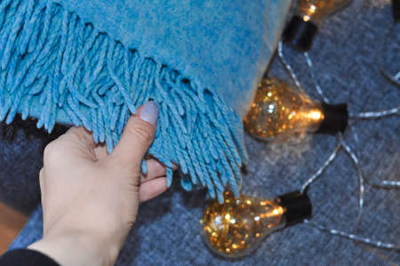 close up of blue blanket on the sofa in living room ,cozy homeの写真素材