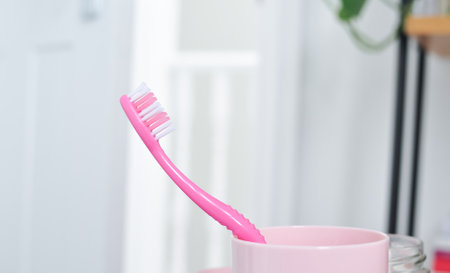 pink teeth brush for everyday cleaning ,morning routine,bathroom accessoriesの写真素材