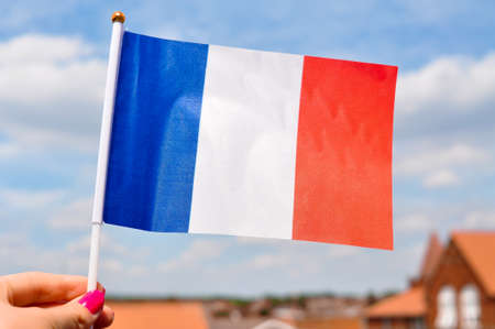 the national flag of France tricolor blue white and red stripes close up.の写真素材