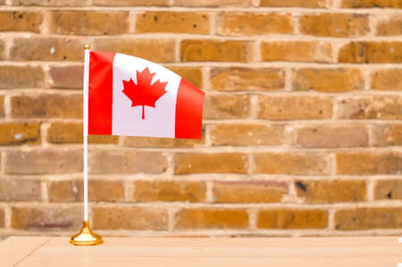 National flag of Canada white and red colors with marple leave.の写真素材