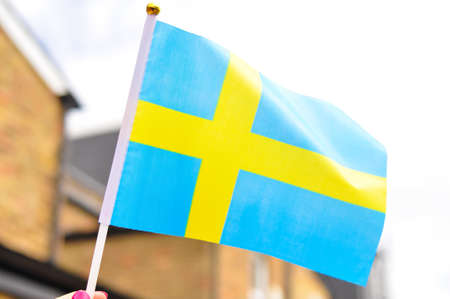 close up of National flag of Sweden yellow and blue colors.の写真素材