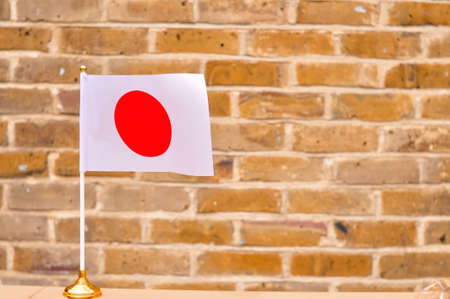 Close up of national flag of Japan round red circle on white background.の写真素材