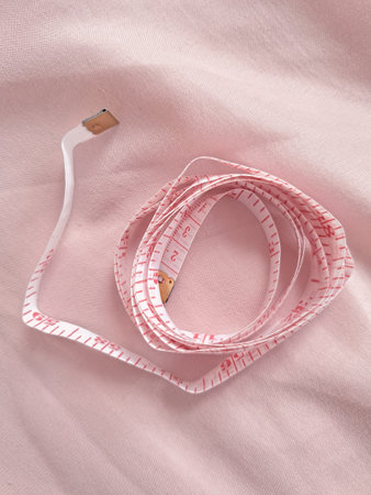 Close up of measure tape in hand copy space. High quality photoの写真素材