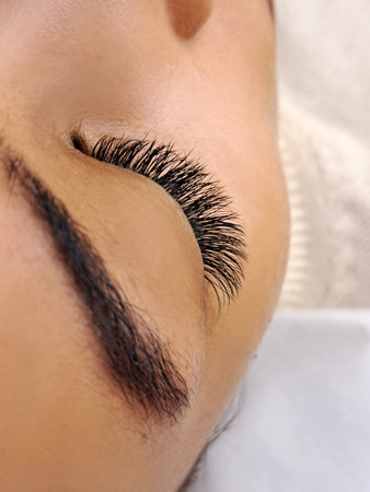 Close up of eyelash Extensions in beauty salon macro eye. High quality photoの写真素材