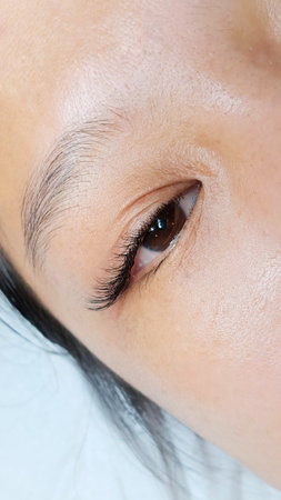 Close up of eyelash Extensions in beauty salon macro eye. High quality photoの写真素材