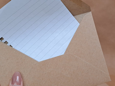 craft paper envelopes in hands background copy space ,の写真素材