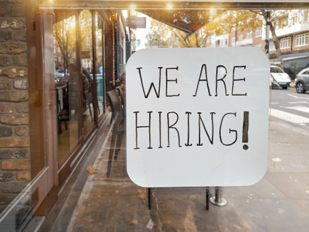 Showcase of street cafe with inscription -we are hiring ,finding job concept. High quality photoの写真素材