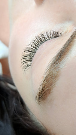 close up of eye with eyelash extensions in beauty salon macro eye top view.の写真素材