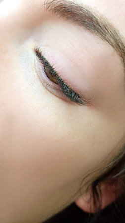 close up of eye with eyelash extensions in beauty salon macro eye top view.の写真素材