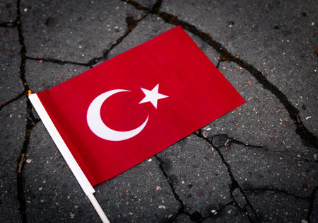 National flag of Turkey on the cracked ground,earthquake concept 2023 tragedy . High quality photoの写真素材
