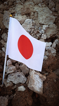 National flag of Japan on the cracked ground,earthquake concept 2023 tragedy . High quality photoの写真素材