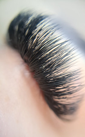 close up of eye with eyelash extensions in beauty salon macro eye top view.の写真素材