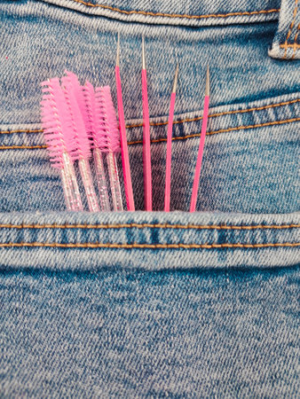 Staff for eyelash extensions in beauty salon, pink equipment for beauticians . High quality photoの写真素材