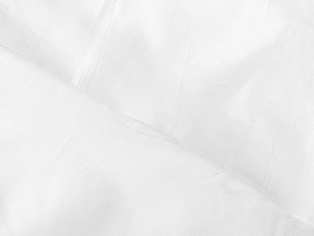white silk fabrik background with copy space for inscription,satin backdrop and wallpaper.の写真素材
