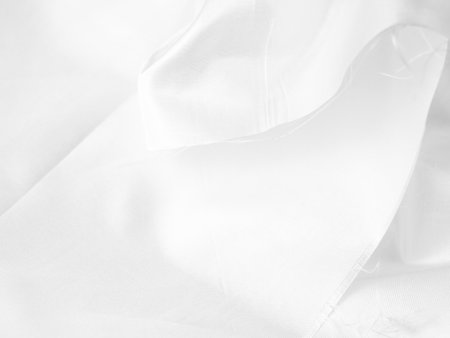 white silk fabrik background with copy space for inscription,satin backdrop and wallpaper.の写真素材