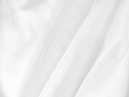 white silk fabrik background with copy space for inscription,satin backdrop and wallpaper.の写真素材